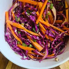 A picture of Red cabbage and carrot slaw.