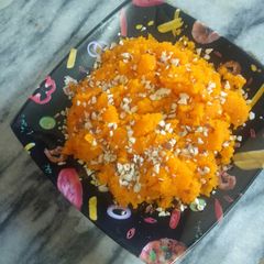 A picture of Sooji Halwa in orange Creation.