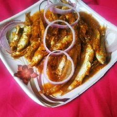 A picture of Sorshe Hilsha Maach Curry.