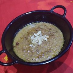 A picture of Porridge with honey.