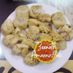 A picture of Steamed Momos with spicy Momos Chutney.