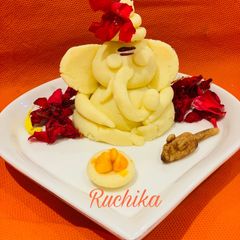 A picture of Coconut Ganpati and Mooshak.