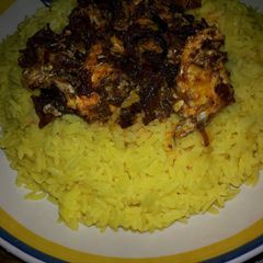 A picture of Tumeric rice with egg sauce.