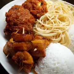 A picture of Rice,spagetti fried plantain with beef.