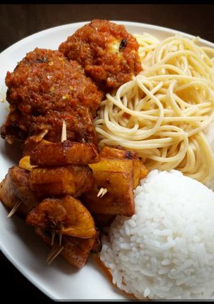 A picture of Rice,spagetti fried plantain with beef.