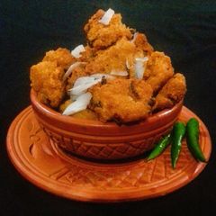 A picture of Piyaju (Red Lentil & Onion fritters).