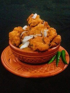A picture of Piyaju (Red Lentil & Onion fritters).