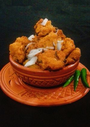 A picture of Piyaju (Red Lentil & Onion fritters).