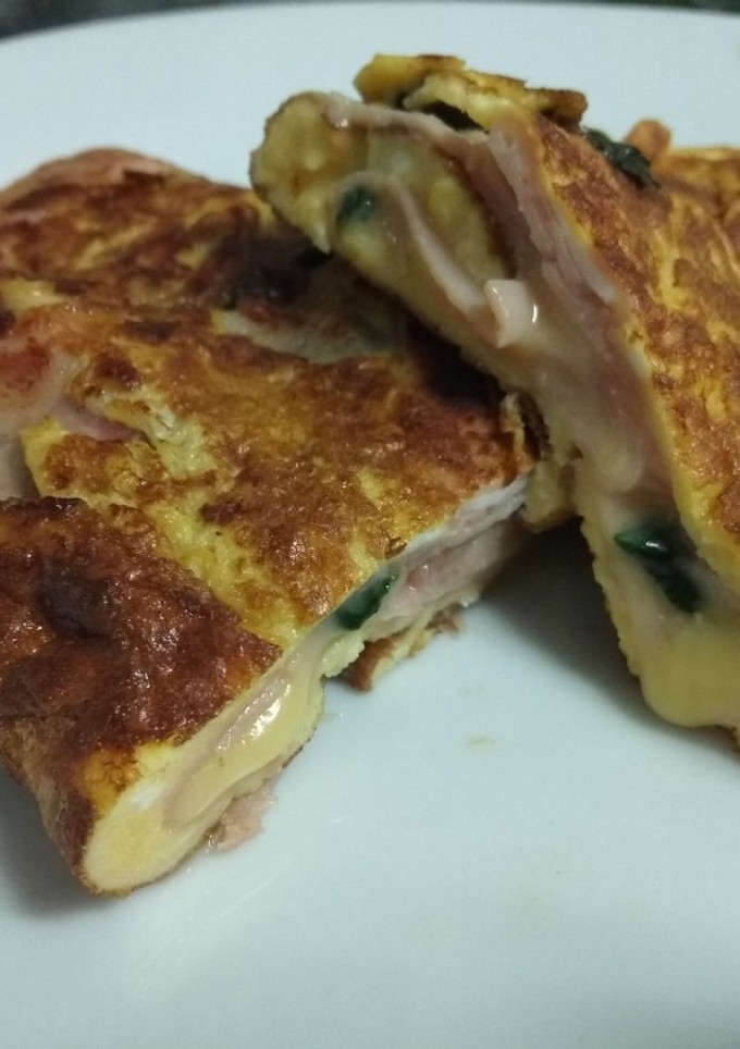 Una foto de Enrollado de pavo, queso y espinacas