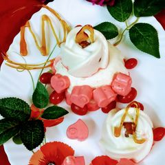 A picture of Gulab jamun stuffed strawberry lassi panna cotta.