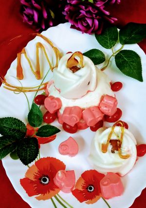 A picture of Gulab jamun stuffed strawberry lassi panna cotta.