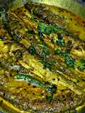 Bata Mach er Jhal (Bata fish in spicy mustard gravy)