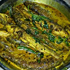 A picture of Bata Mach er Jhal (Bata fish in spicy mustard gravy).
