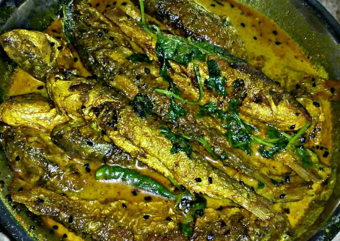 Bata Mach er Jhal (Bata fish in spicy mustard gravy)