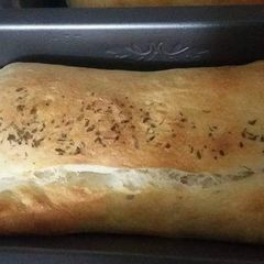 A picture of Chicken and Cheese 🧀 filled oregano Bread 🍞.