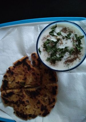 A picture of Makki ka parantha & brinjal Raita.