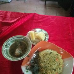 A picture of Fish pepper soup,fried rice with liver souce nd pineapplesegment.