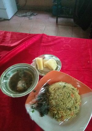 A picture of Fish pepper soup,fried rice with liver souce nd pineapplesegment.