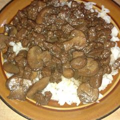 A picture of Beefy Mushroom Steak Bites over Rice.