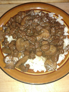 A picture of Beefy Mushroom Steak Bites over Rice.