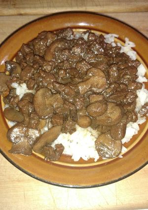 A picture of Beefy Mushroom Steak Bites over Rice.