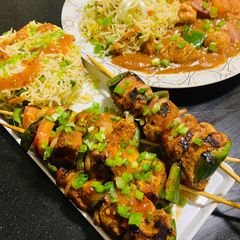 A picture of Chicken shashlik with Fried Rice.