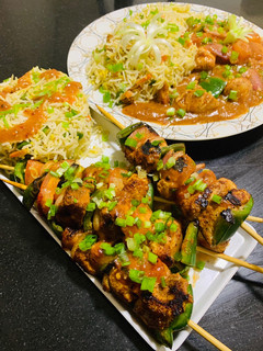 A picture of Chicken shashlik with Fried Rice.
