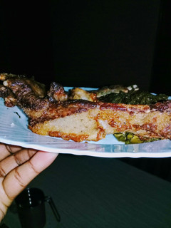 A picture of Grilled Pork served with kales#festive season Kakamega.