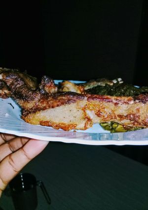 A picture of Grilled Pork served with kales#festive season Kakamega.