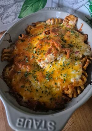 Une photo de Cross fries au cheddar et lardons
