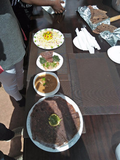 A picture of Chicken steck, Pegion soup with desert.