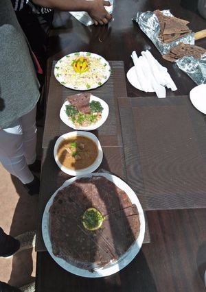 A picture of Chicken steck, Pegion soup with desert.