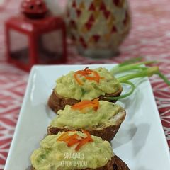 A picture of Moong and Chana Hummus on toasted bread.