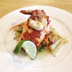 A picture of Roasted red pepper and walnut pesto salmon.