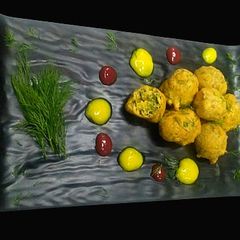 A picture of Dil leaves and spinach fritters.
