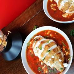 A picture of Mexican tomato, chicken and refried bean soup.