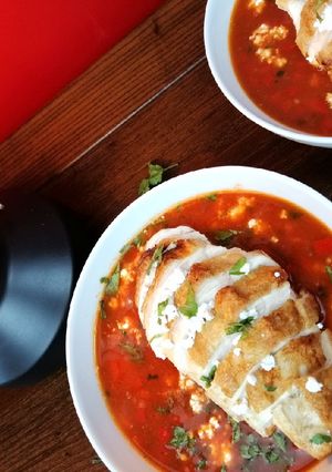 A picture of Mexican tomato, chicken and refried bean soup.