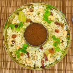 A picture of Malabar Special Ghee Rice 🍚 Ney Choru- With Cherry 🍒 tomato Rasam (Kerala Cusine)💁‍♀️.
