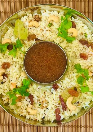 A picture of Malabar Special Ghee Rice 🍚 Ney Choru- With Cherry 🍒 tomato Rasam (Kerala Cusine)💁‍♀️.