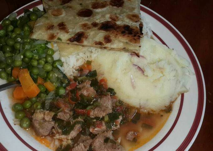 Mashed Potatoes Served with Beef,peas stew, Chapati and rice