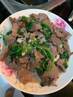 Hình của món Thịt trâu xào rau muống.