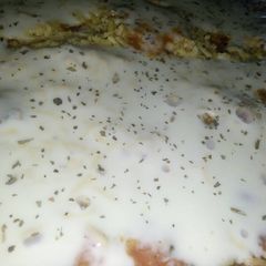 A picture of Chicken Alfredo in Tomato Sauce.