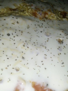 A picture of Chicken Alfredo in Tomato Sauce.