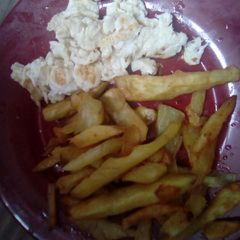 A picture of Scrambled eggs and fries.