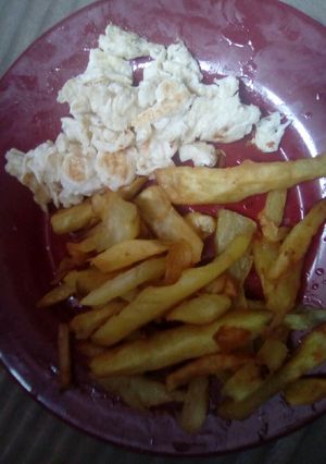 A picture of Scrambled eggs and fries.