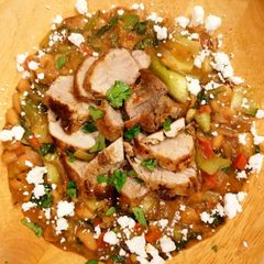 A picture of Pork Tenderloin with Butter Beans and a Red Pesto Sauce & Feta.