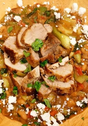 A picture of Pork Tenderloin with Butter Beans and a Red Pesto Sauce & Feta.