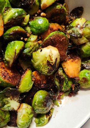 A picture of Brussels Sprouts with toasted pecans.