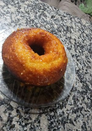 Una foto de Budín de naranja con almíbar de mandarina y miel
