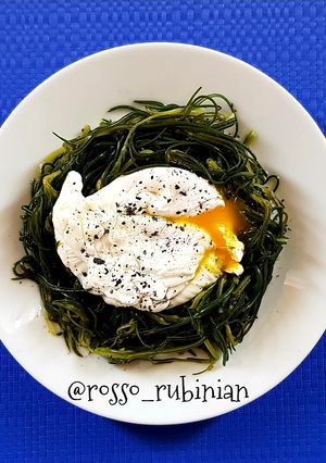 A picture of Poached Egg on a Bed of Agretti.